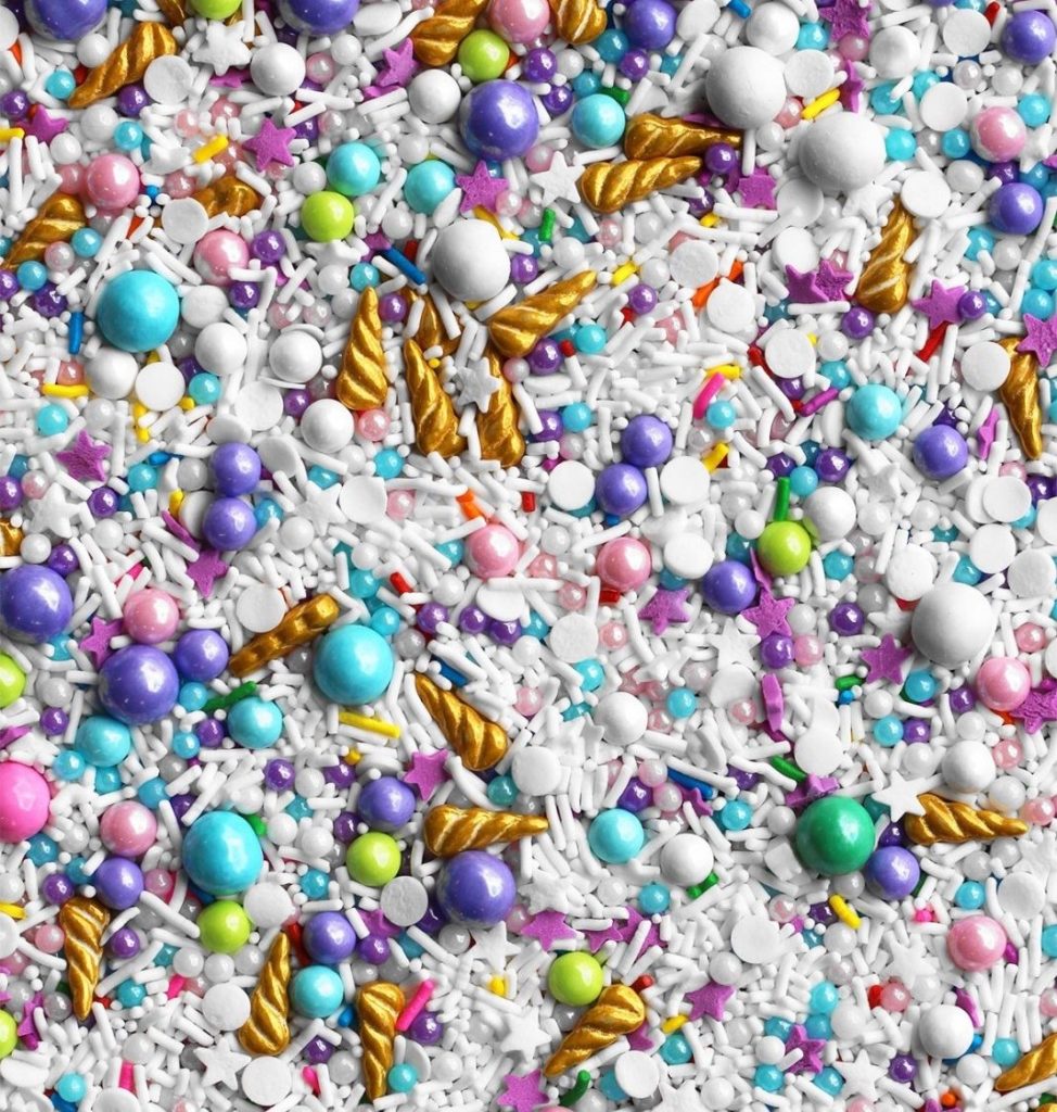 Colorful sprinkles with golden unicorn horns.